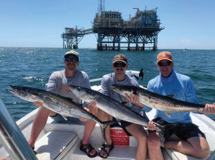 people with fish they caught at off the hook charters 10